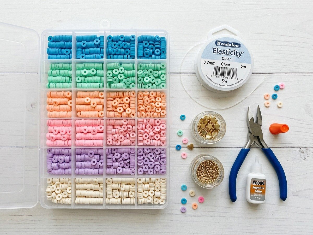 Complete DIY supplies for preppy clay bead bracelets including sorted heishi beads elastic cord and jewelry glue